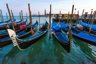 Boats moored in sea