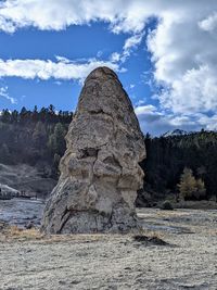 Rock formations on landscape against sky