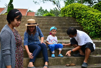 Family sitting on steps