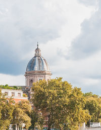 View of temple building against cloudy sky