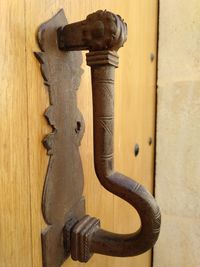 Close-up of door knocker on wall