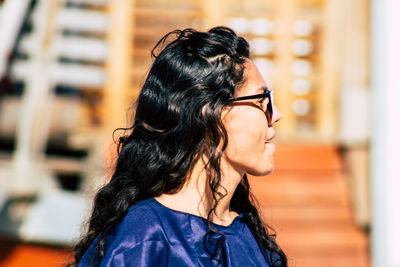 Portrait of woman looking away outdoors