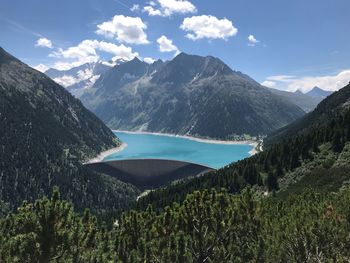 Scenic view of lake and mountains against sky