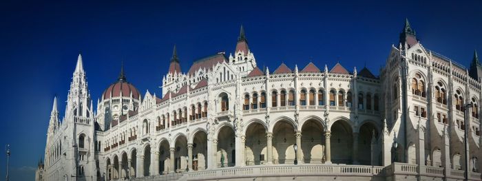 Low angle view of historic building against blue sky