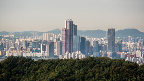 Buildings in city against sky