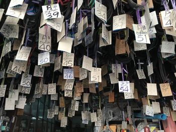 Low angle view of size tags hanging in store