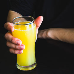 Close-up of hand holding drink