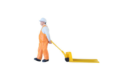 Rear view of man working against white background