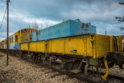 Train on railroad track against sky