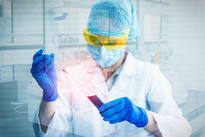 Double exposure of girl experimenting in laboratory