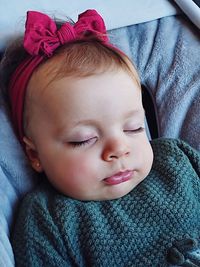 Close-up of cute baby girl sleeping