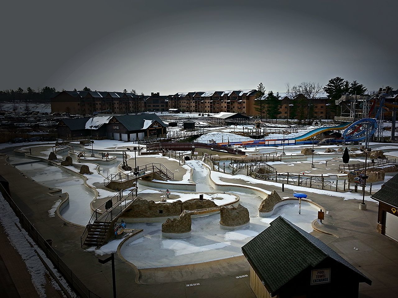 building exterior, architecture, built structure, high angle view, clear sky, city, snow, beach, cold temperature, winter, house, residential structure, residential building, sky, outdoors, transportation, copy space, moored, incidental people, no people