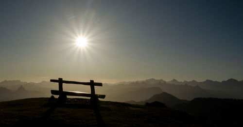 Scenic view of silhouette mountains against sky