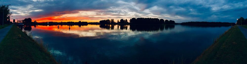 Panoramic view of lake against sky during sunset