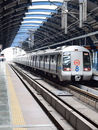 Delhi metro train arriving at jhandewalan metro station in new delhi, india, asia, public metro rail