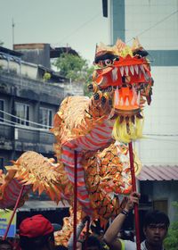 People celebrating chinese new year on street in city