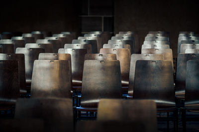 Empty chairs arranging in darkroom