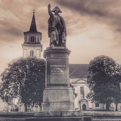 Low angle view of statue against building