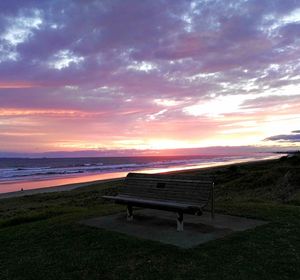 Scenic view of beach against sky during sunset