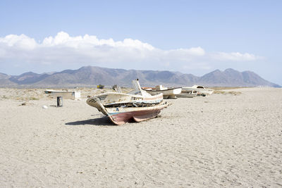 Abandoned boats on the beach of cabo de gata, almeria