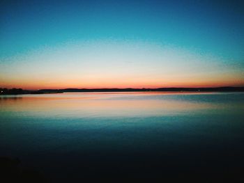 Scenic view of sea against clear sky during sunset