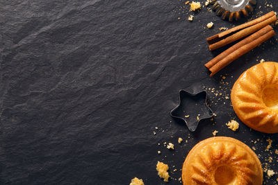 High angle view of cinnamons with cookies