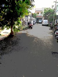 Street by city against sky