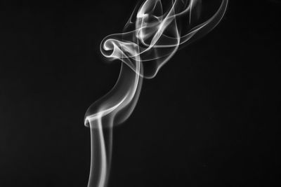 Close-up of smoke against black background