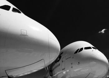 Close-up of airplane flying against sky
