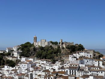 The white village of casares in southern spain against clear blue sky