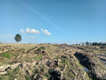 Scenic view of land against sky