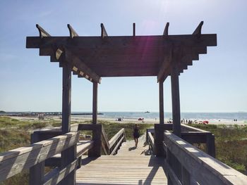 View of built structure by sea