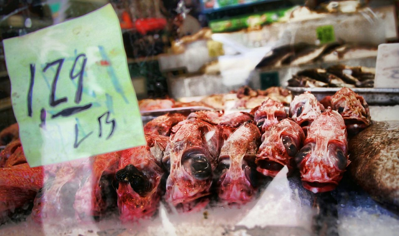 indoors, for sale, food and drink, retail, food, still life, variation, market stall, close-up, choice, seafood, market, selective focus, sale, large group of objects, freshness, fish, display, store, text