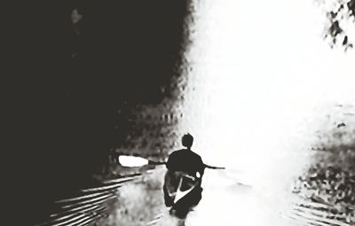 Reflection of woman in water