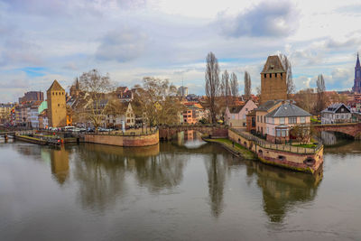 Panoramic view of river and buildings against sky