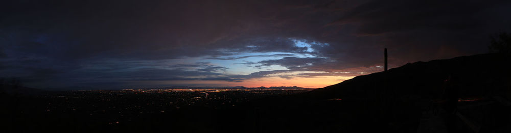 Silhouette landscape against sky during sunset