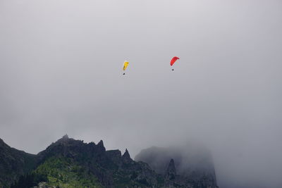 Low angle view of kite flying in sky