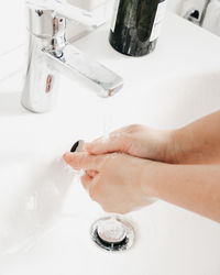 Midsection of young woman in bathroom