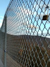 Chainlink fence against sky