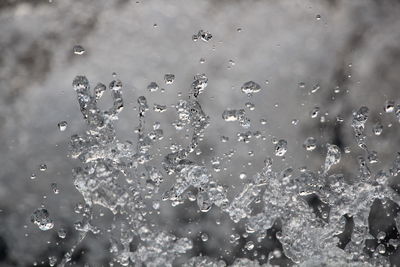 Full frame shot of raindrops on water
