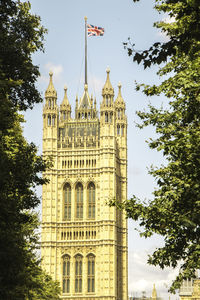 Low angle view of clock tower against sky