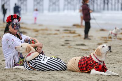 Low section of man lying on sand