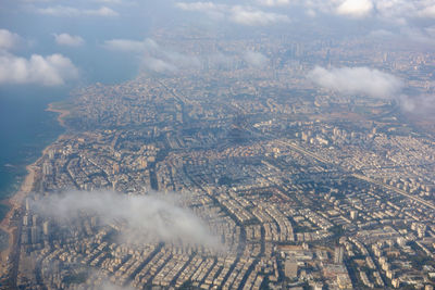 Aerial view of cityscape against sky