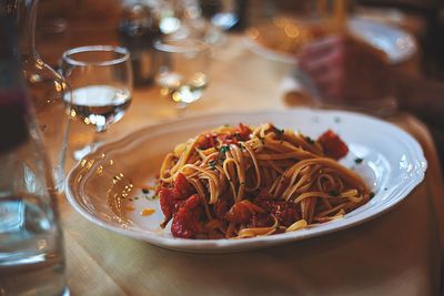 Close-up of spaghetti seafood served on table