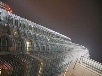 Low angle view of modern building against sky at night