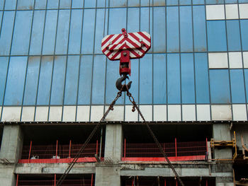 Low angle view of red umbrella against sky