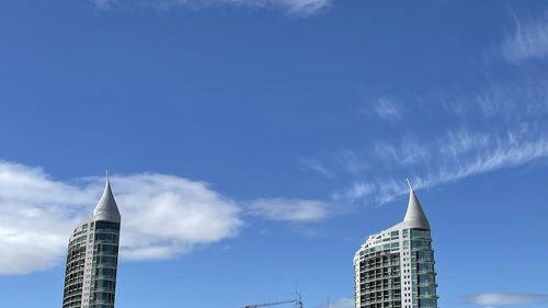 Low angle view of building against cloudy sky