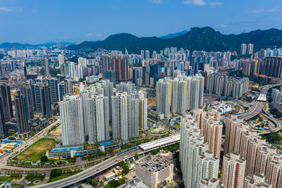 High angle view of buildings in city against sky