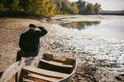 Man photographing at camera