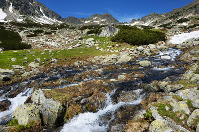 Scenic view of waterfall against sky